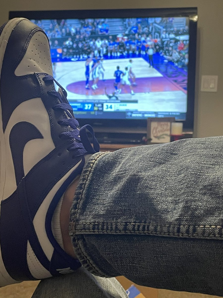 DribbleDefender's tweet photo. Perfect Birthday!!  Watching @KUHoops wearing my birthday present… KU blue Dunks 🏀 https://t.co/oeYQYaydXc