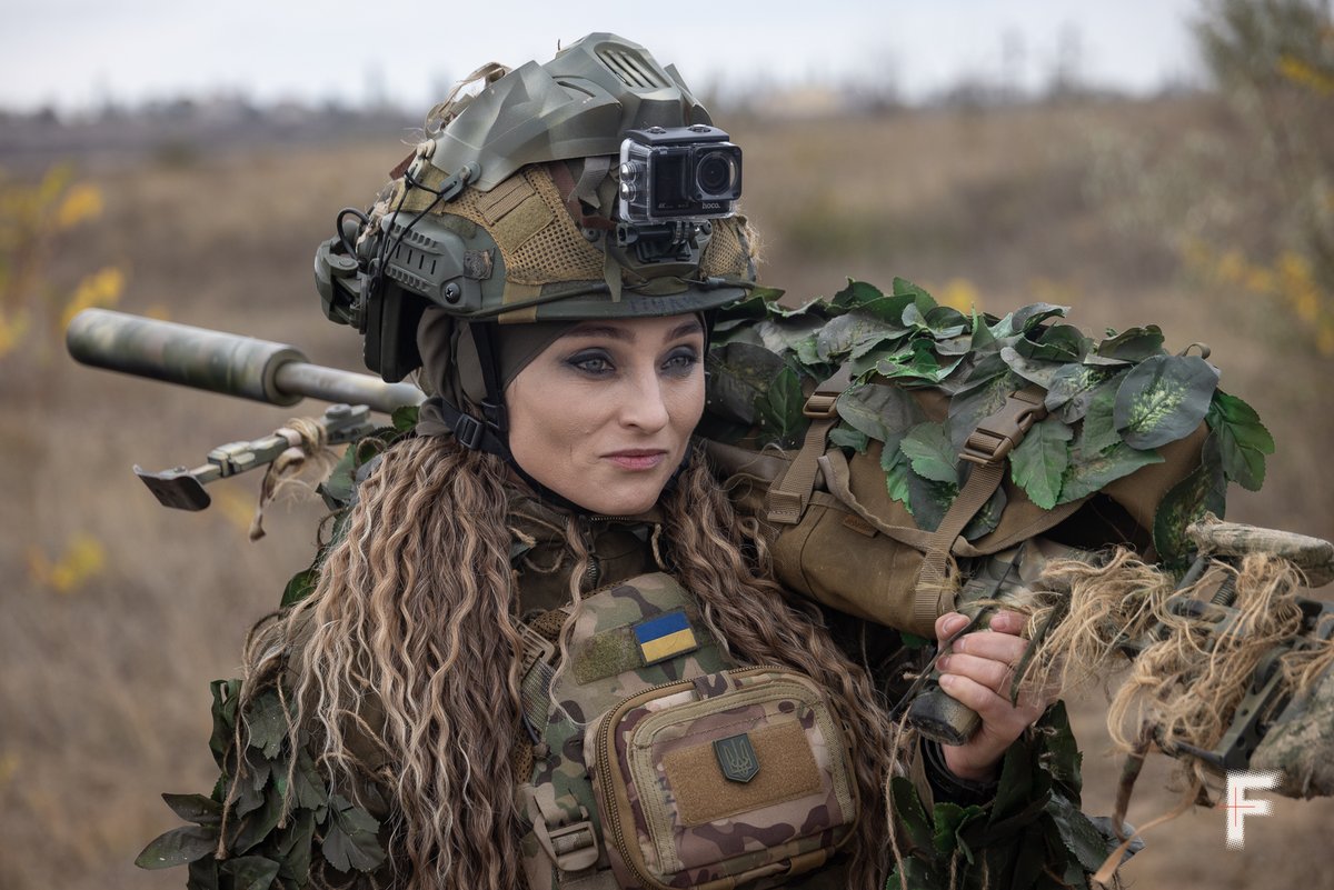 EuromaidanPress's tweet photo. After surviving Russian occupation, sniper “Pulia” chose to fight for Ukraine. Spent her savings on gear, trained herself &amp; joined the 124th Bde.

“I went instead of my son so he wouldn’t have to fight,” she says. Now, she stands with her battalion to the end.

📷Andriy Dubchak https://t.co/4fufPtGjRK