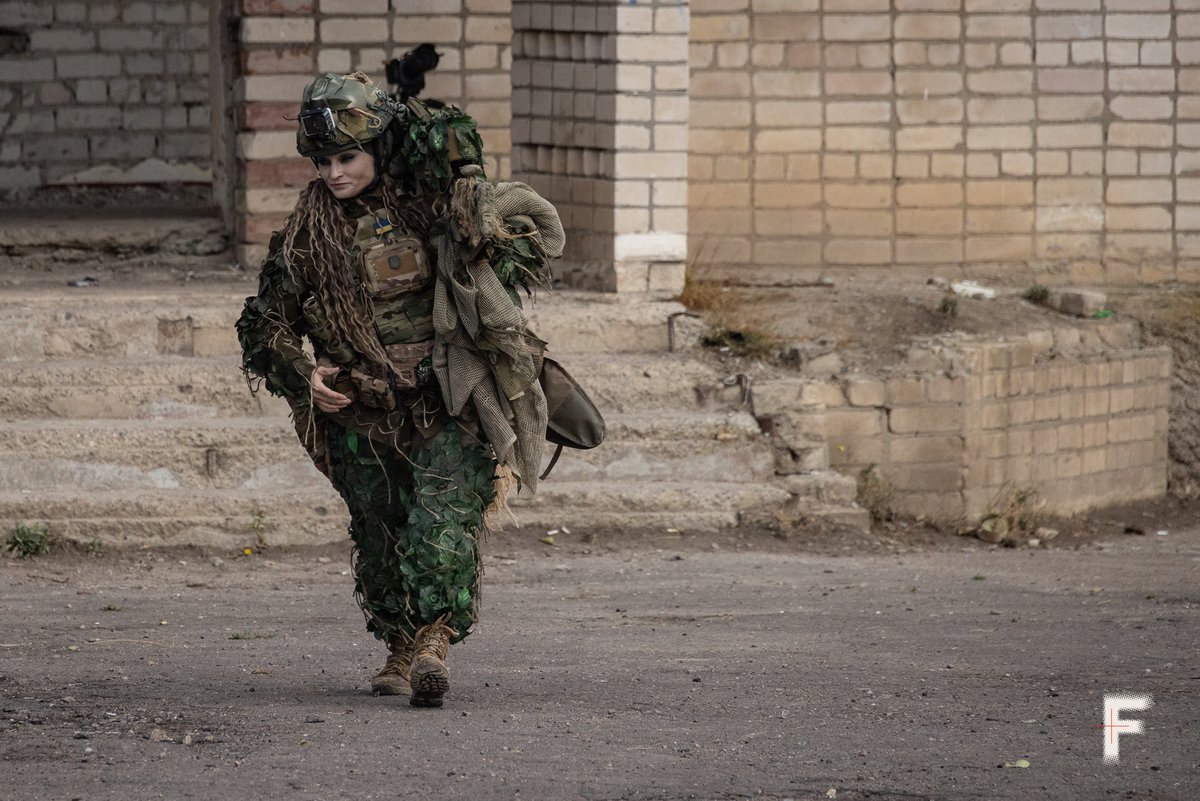 EuromaidanPress's tweet photo. After surviving Russian occupation, sniper “Pulia” chose to fight for Ukraine. Spent her savings on gear, trained herself &amp; joined the 124th Bde.

“I went instead of my son so he wouldn’t have to fight,” she says. Now, she stands with her battalion to the end.

📷Andriy Dubchak https://t.co/4fufPtGjRK