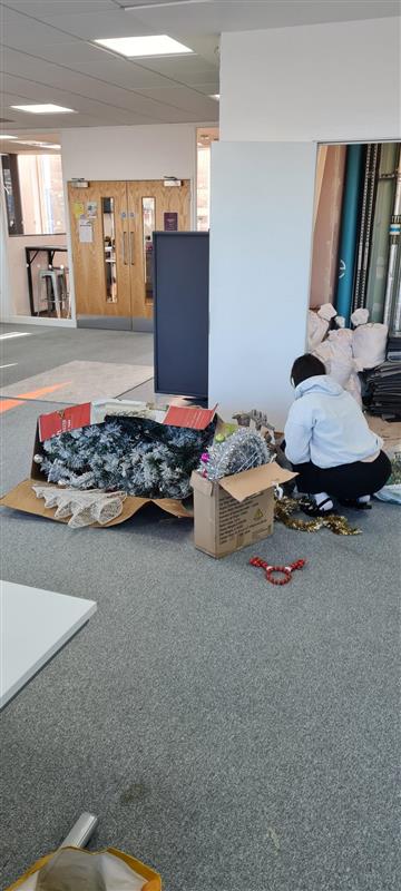 When the graphic designer tries to convince the team she's busy with "work" and you look up to see her putting the Christmas tree up 🙄

(We love it really)

Do you have trees up in your office, or is it still too early?