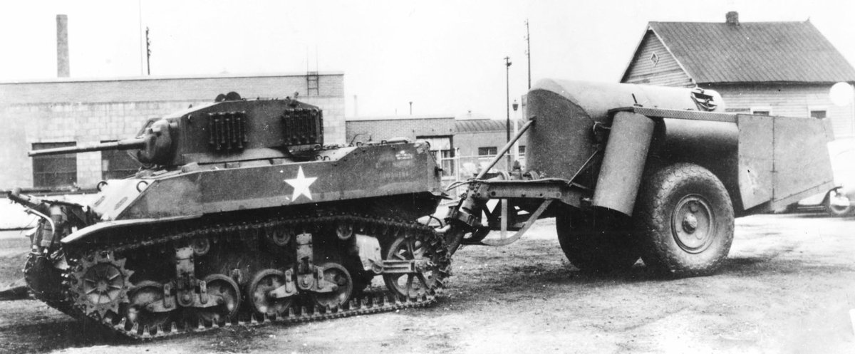 KrypTanko's tweet photo. Today’s “Odd Tank” is the American E9-9 Mechanized Flamethrower prototype.

Built on a M5A1 Stuart like the E7-7, this flame tank would instead keep the 37mm gun and place the flame projector in the hull. All the other flame thrower equipment and fuel would be in the massive trailer it towed.

During testing the main fuel tank would explode, covering the tank in fire and sadly resulted in the death of the crew and the project was ended.
