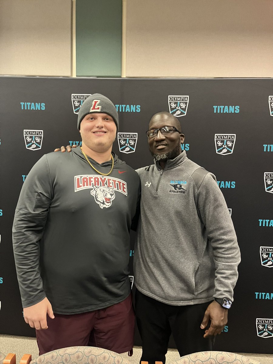 RealOlympiaTitansFB (@titans_fb) on Twitter photo It’s official. <a href="/Pmoss_34/">Parker Moss</a> is a Lafayette Leopard. On to the next chapter for our Captain. Congrats Parker. #TitansUp
I’m sure <a href="/Pmoss_34/">Parker Moss</a> and <a href="/CoachGabe34/">Travis Gabriel</a> enjoyed this moment. It’s official. <a href="/Pmoss_34/">Parker Moss</a> is a Lafayette Leopard. On to the next chapter for our Captain. Congrats Parker. #TitansUp
I’m sure <a href="/Pmoss_34/">Parker Moss</a> and <a href="/CoachGabe34/">Travis Gabriel</a> enjoyed this moment.