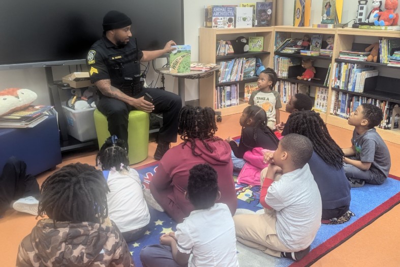 APSFLSTRONG's tweet photo. Shoutout to Officer Harris for reading "What the Road Said" to our 2nd graders! Building trust, inspiring young minds, and strengthening community—one story at a time. #BooksandBadges #WhattheRoadSaid #FLStrong #FullSTEAMAhead @APSMediaServ @APSSafety https://t.co/klAerAhVCc