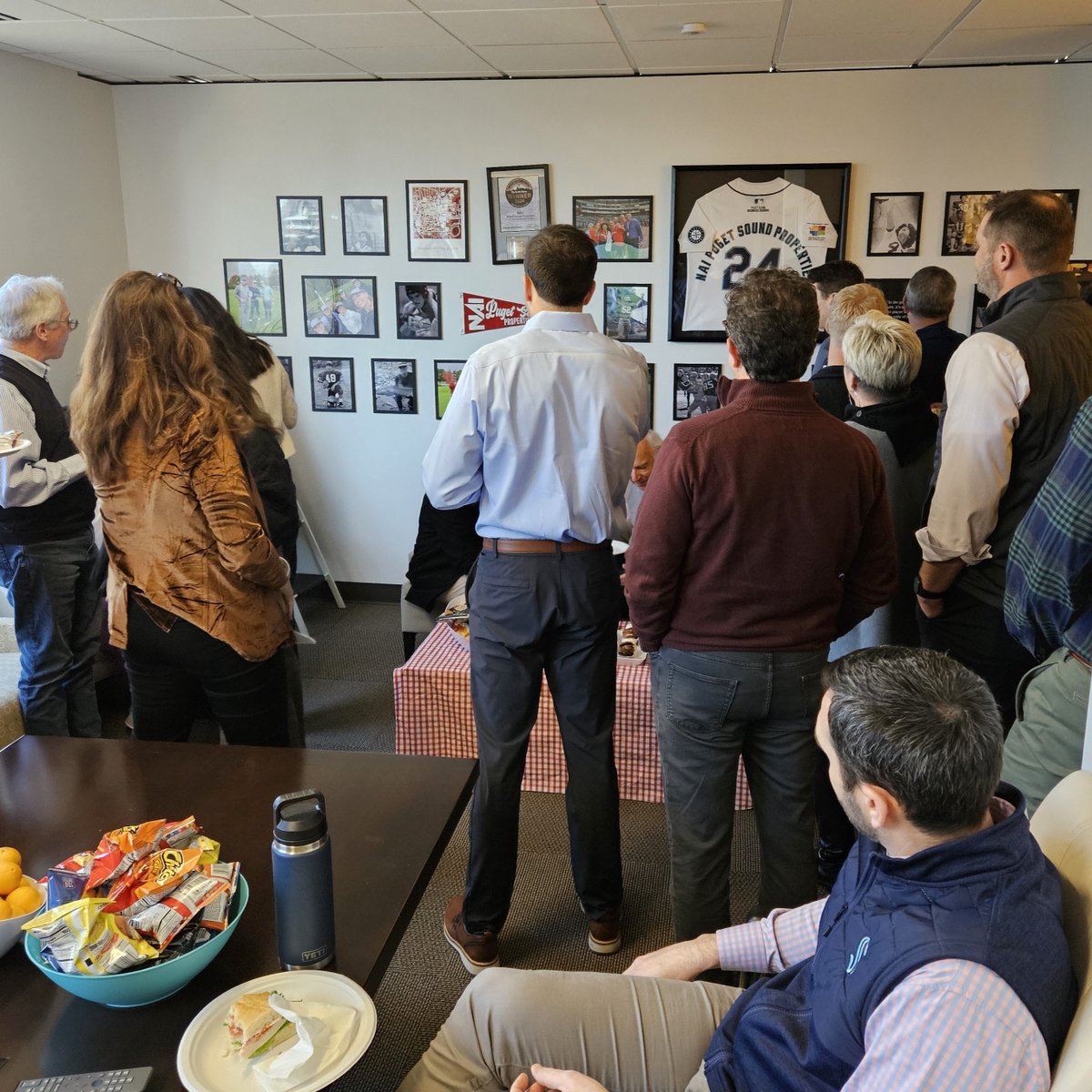 NAIPSP's tweet photo. This week, we hosted the Tacoma Office/Southend Industrial Meeting at Bellevue, celebrating 2024 wins and unveiling Project MVP: a gallery wall of sports photos honoring our team's passion and teamwork! #NAIPSP #NAIPSPeople #HallOfFame #GalleryWall #UWAlumni #WSUAlumni https://t.co/D6HKM9j8Hk