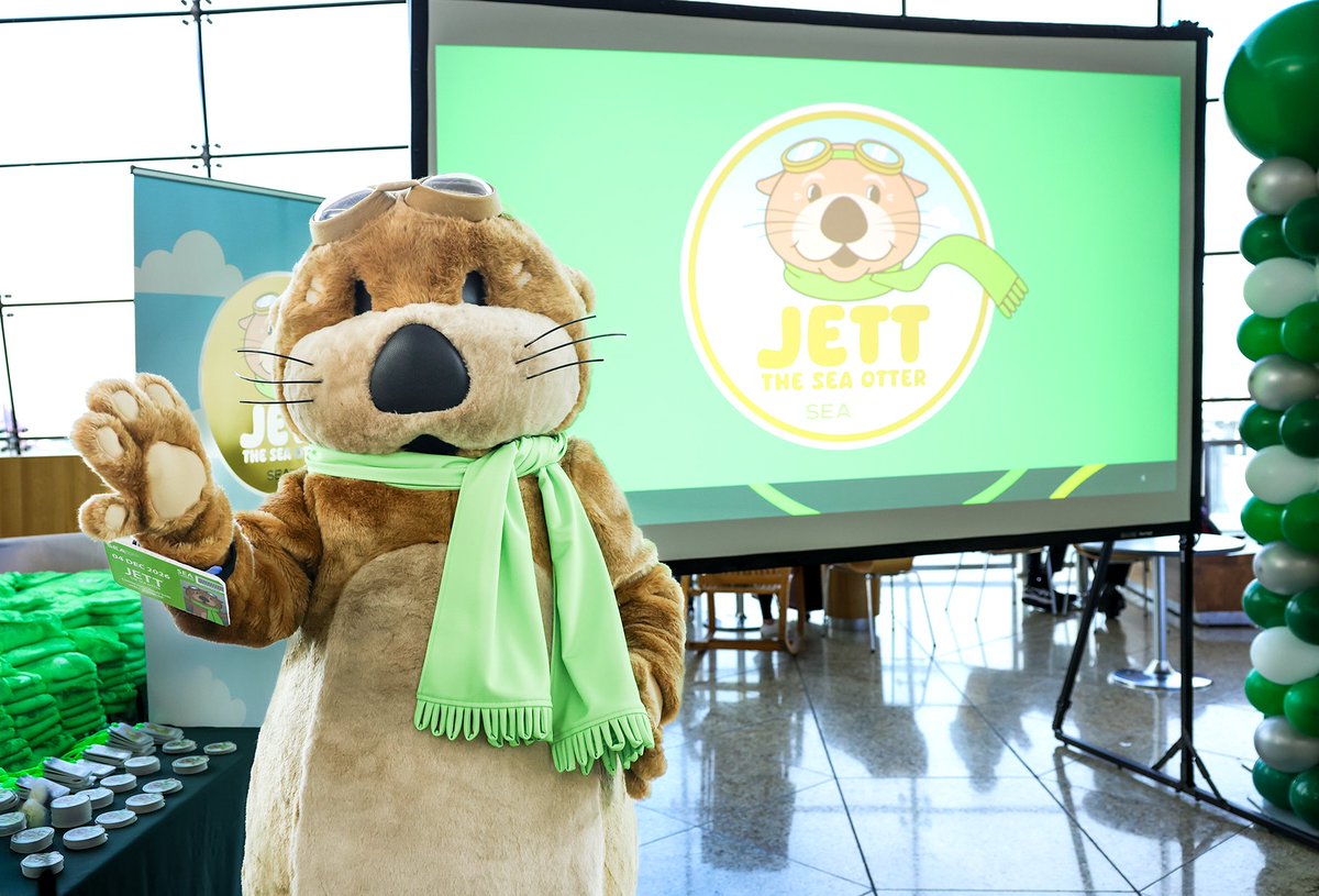 flySEA's tweet photo. Meet Jett, the SEA Otter! 🦦 Travelers welcomed our newest team member today. Jett, like the warm and playful mammals of the Pacific Northwest, embodies SEA Customer Service values: helpfulness, efficiency, originality, and a natural, welcoming spirit. 💚 https://t.co/kQI6ojDYz0 https://t.co/nPpqzaCgRh