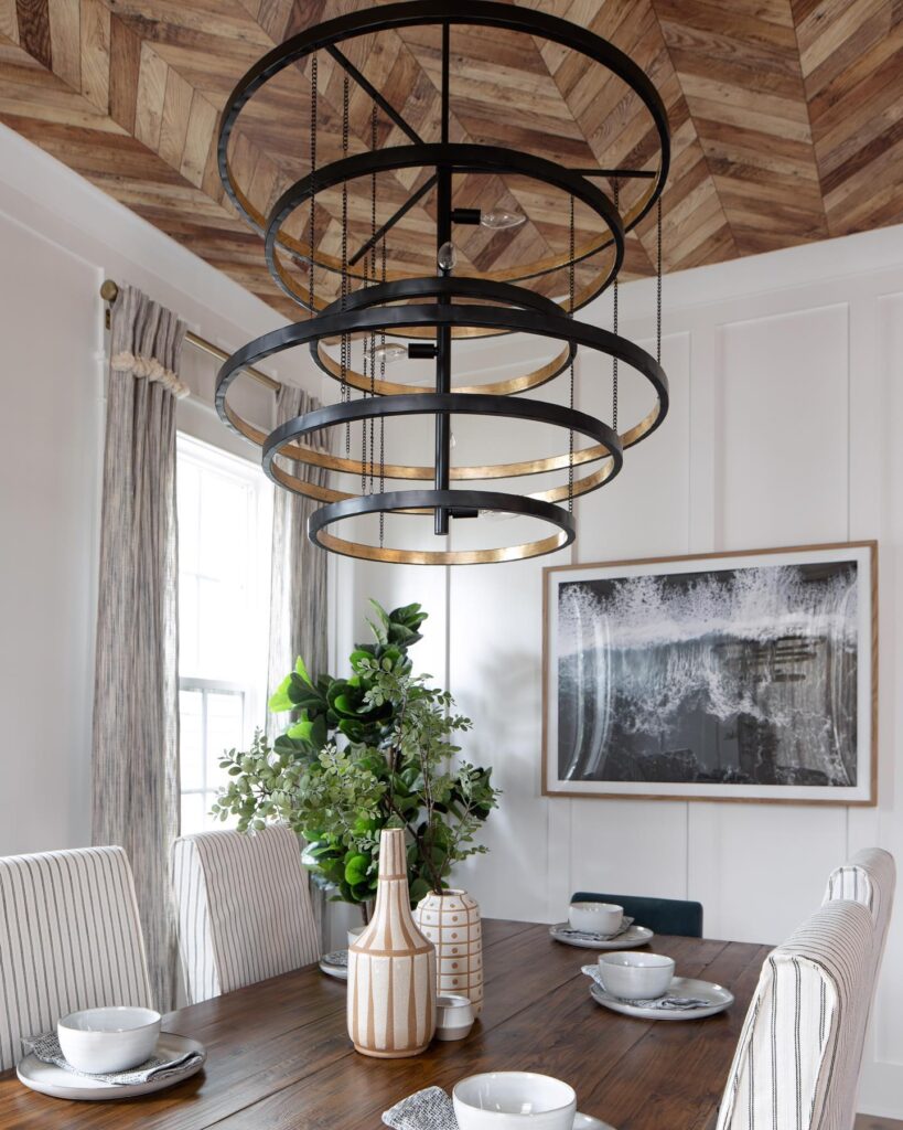 Looking for the perfect ambiance to celebrate the holidays with your loved ones? 

Consider a stunning dining space decorated with elegant fixtures like the Celeste chandelier by Generation Lighting, which adds sophistication and warmth. 😍 

Shop now: bit.ly/3C1Jhs0