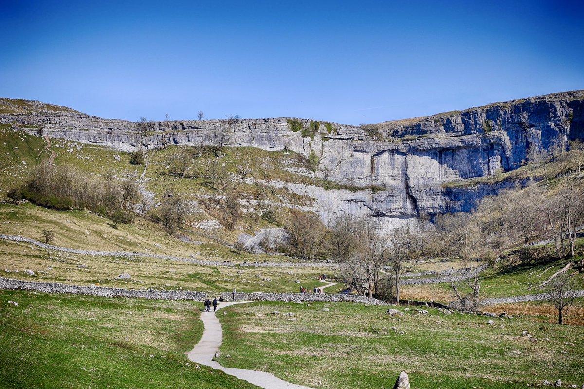 traveltipsx's tweet photo. Explore Malham Cove: A Yorkshire Wonder 🌿🏞️

Malham Cove, located in the stunning Yorkshire Dales, is a natural limestone amphitheater shaped by an ancient waterfall over 12,000 years ago. 

Here’s why it deserves a spot on your travel list:

Limestone Pavement: The unique rock formations at the top are a photographer’s dream and featured in Harry Potter and the Deathly Hallows.

Breathtaking Views: Climb to the top for sweeping vistas of the Dales.

Wildlife & Nature: Spot peregrine falcons and rare wildflowers while soaking in the tranquility.

Nearby Gems: Extend your visit to see Gordale Scar, a dramatic ravine, and Janet’s Foss, a magical woodland waterfall.

Travel Tips: Arrive early, wear sturdy shoes (the rocks can be slippery!), and pack a picnic to enjoy the serene surroundings. Malham Cove is an unforgettable adventure for hikers, photographers, and nature lovers alike!

Have you visited? Share your favorite memory below! 🌟

#MalhamCove #YorkshireDales #HikingAdventures #NatureLovers #TravelTips #harrypotter