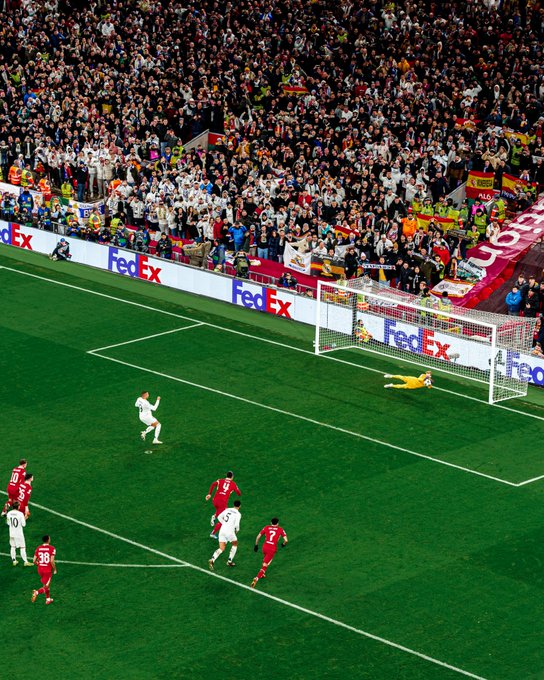 Photography of Caoimhin Kelleher saving Kylian Mbappe's penalty.