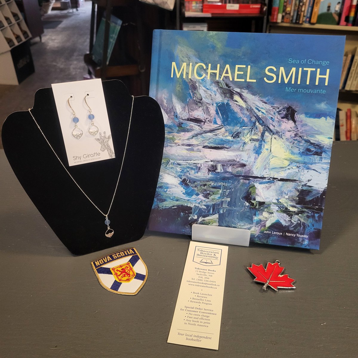 Tidewater_Books's tweet photo. Today's Featured #CanLit in-store is 'Michael Smith: Sea of Change' by John Leroux & Nancy Tousley! Seen here with #MadeInNS Shy Giraffe jewelry set. 💕🇨🇦📚
https://t.co/WtFcBxaVCB
#IndieBookstoreCA #ShopSmall #Fallinlovewithlocal @goose_lane https://t.co/00IUWQtTyB