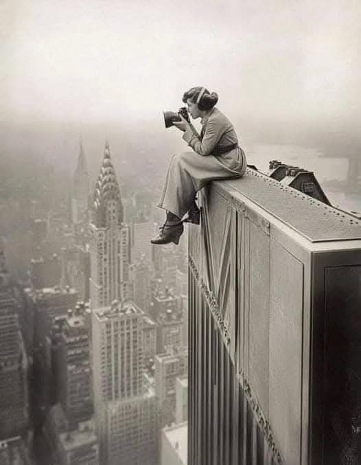 Photographer Margaret Bourke-White taking a photo from the top of a Building in 1935.

She broke barriers as the first female photographer for Life magazine, with one of her photos gracing its inaugural cover in 1936.