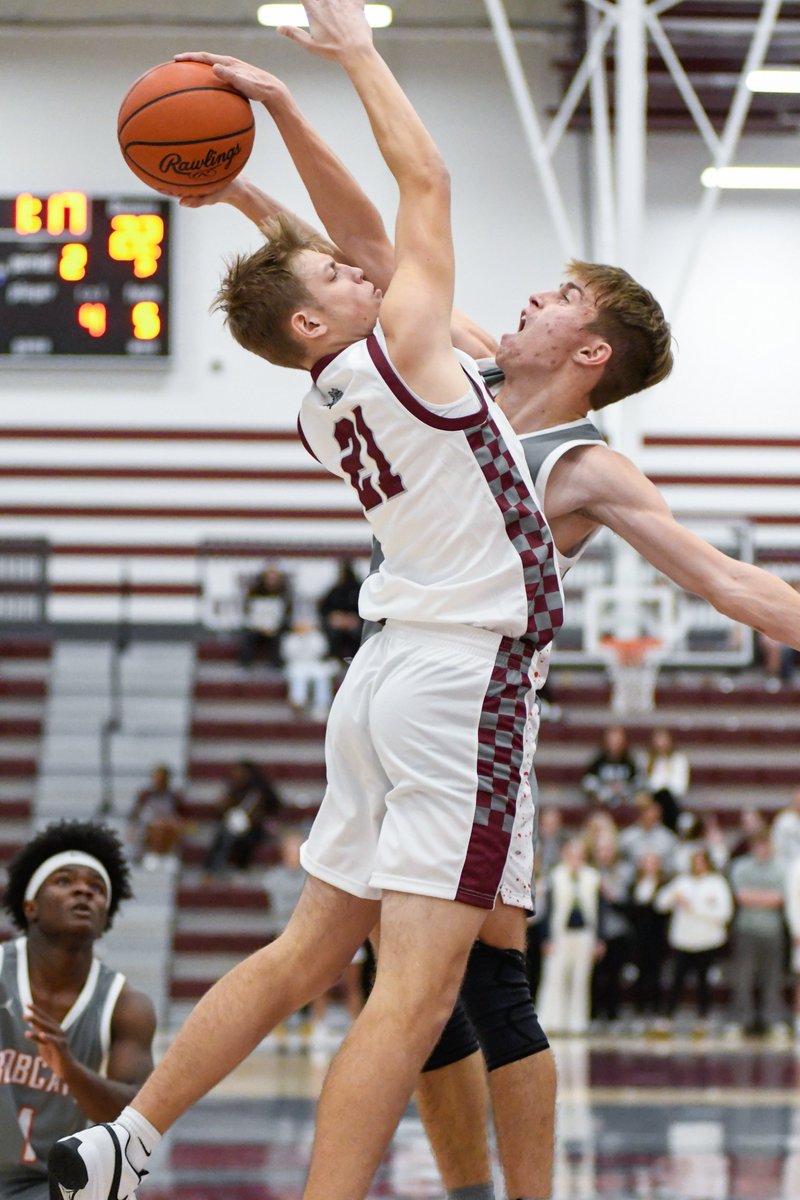Bowling Green's Tomas Meek blocks Rossford's Carter Matthews in his team's 64-56 win tonight. The image is an early contender for my favorite image of the basketball season.

Full story at sent-trib.com later tonight.

<a href="/BGBoysBball/">BG Boys Bobcat Bball</a>