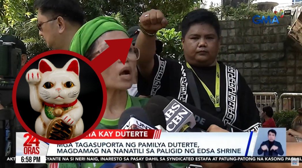 nagdala sila ng fortune cat nung nasa edsa shrine sila