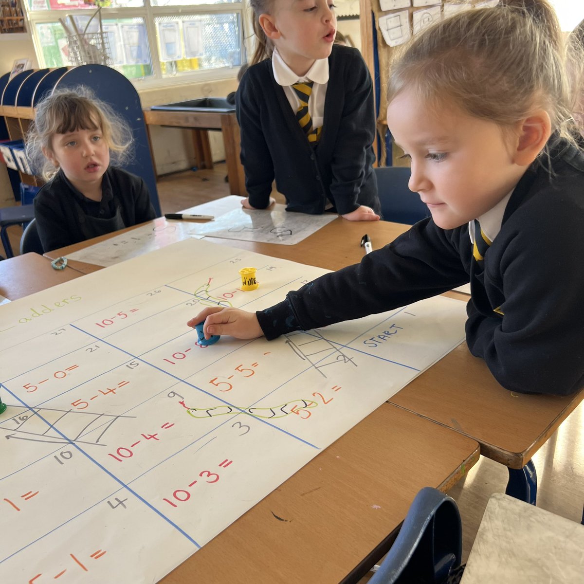 MissMackayKPS's tweet photo. Lots of fun today during our numeracy. We were learning to subtract and played a game of snakes and ladders. We practised our subtraction and turn taking &amp; sharing. 🐍🪜➖@Kinneil_PS https://t.co/Cr0I5N7rkY
