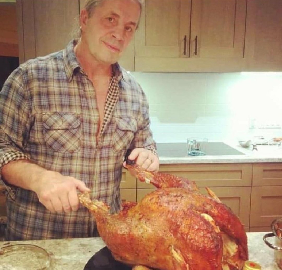 Why does it look like Bret Hart is about to apply the sharpshooter to his thanksgiving turkey? 😂