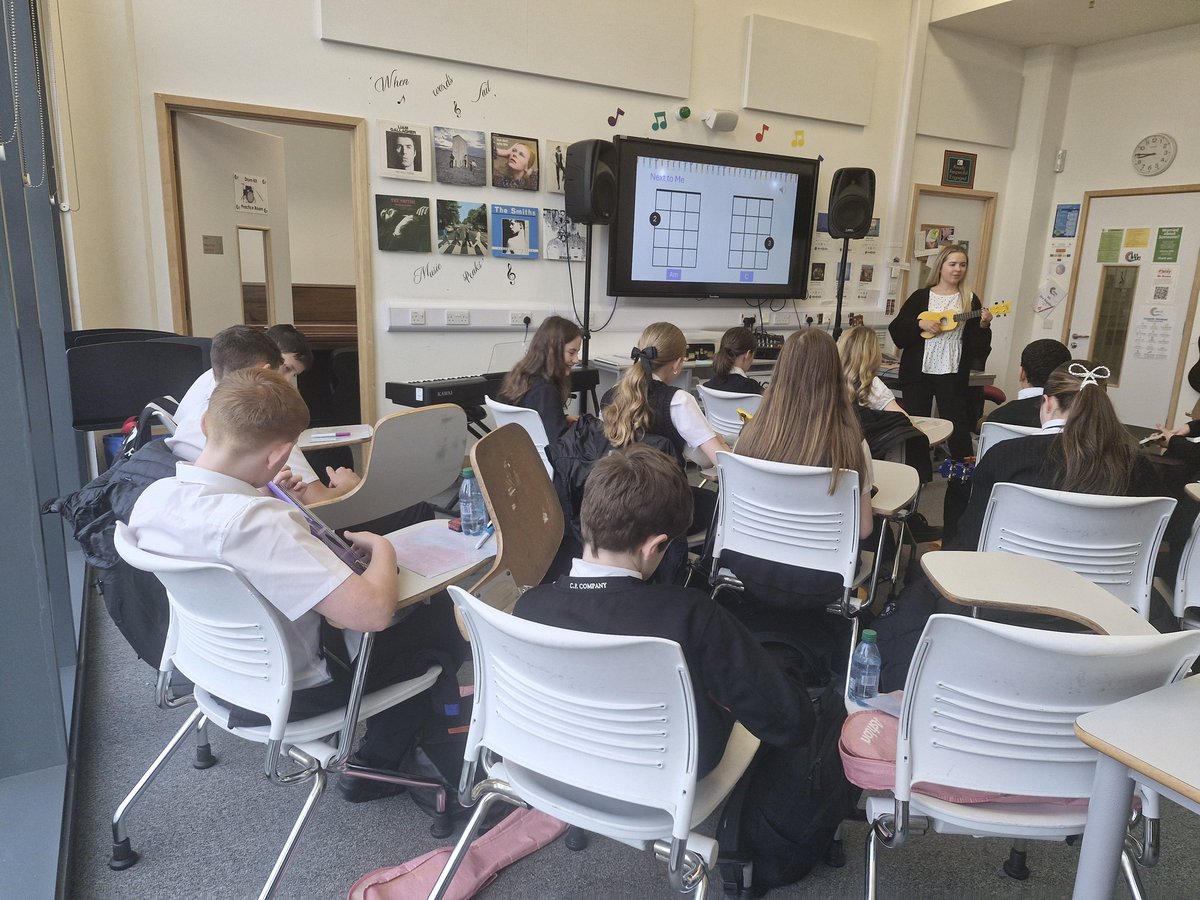 MusicDrama1's tweet photo. S1 pupils are loving learning a new skill in Music   by playing the ukulele. This is @MissAPalmer teaching some chords to class 1.6 today. 
#schoolvalues 
#determination, #ambition, #growth
@GarnockCampus https://t.co/DxgjPpQJ44