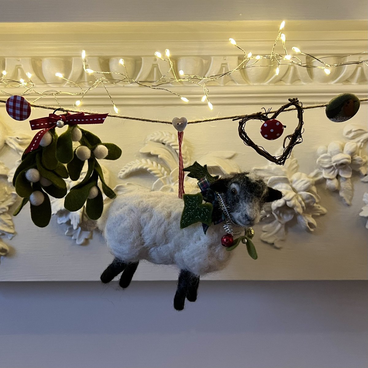 WildandWool's tweet photo. Orla sheep was hugely proud of her Scottish heritage and trod lightly between the carpets of heather on the brushy hillsides as the grey clouds dropped their snowy load ❄️
#Christmasgarland #blackfacesheep #choosewool #campaignforwool #madeinBath #fortheloveofwool #needlefelt https://t.co/g2MRAxLKQd
