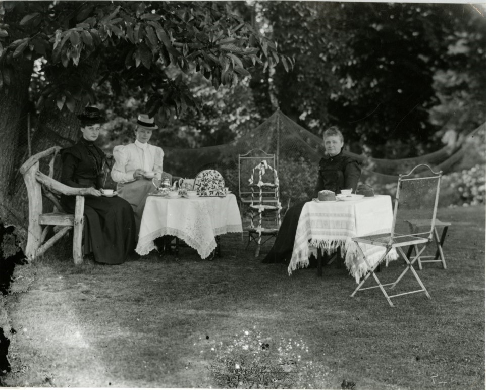 Afternoon tea in the garden at Sutton Hall with silver and cake stand. Elizabeth and her son Francis, and a nursemaid for the baby. From the Sclater family album. Ref: AMS/5643/3/10 #EYAFamily