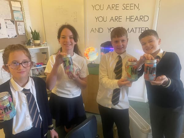nlancingprimary's tweet image. Making lanterns for Lantern Day! These were made by sticking coloured paper on the outside of jars. The children then put kind words on them like joy, happy, funny and kind. 😀