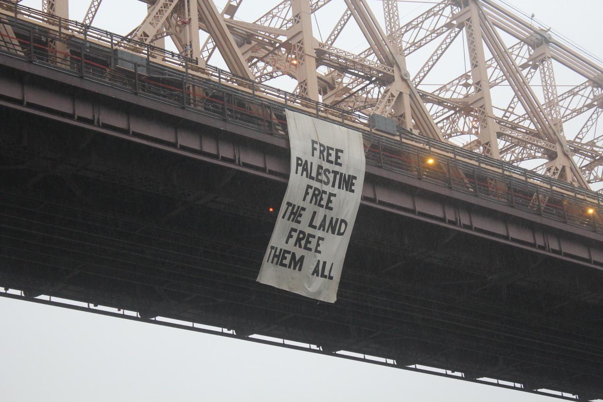 Massive banners dropped off the Queensborough bridge in New York City today by autonomous activists /1