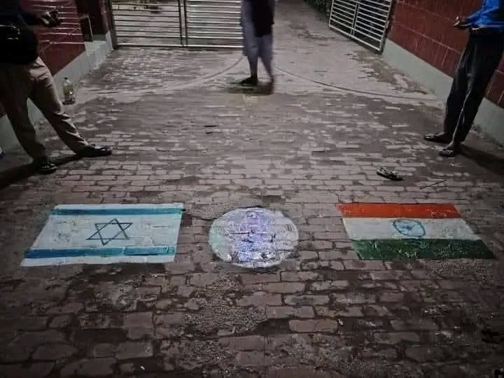 salokkusa's tweet photo. @IndianSinghh Bangladesh, Bogura Polytechnic Institute in front, Israel flag on the left, ISKCON logo in the middle, all walking over India flag https://t.co/mul964cPT6