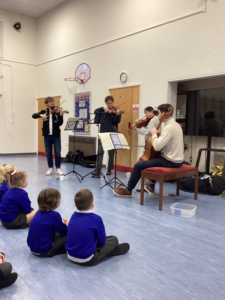 crowanschool's tweet photo. This week we were lucky enough to have a visit from @ElmoreQuartet , who performed a range of music for the children and taught them about their instruments. The children were mesmerised by their performance! We felt very privileged to hear them. https://t.co/8SnBsFGh3P