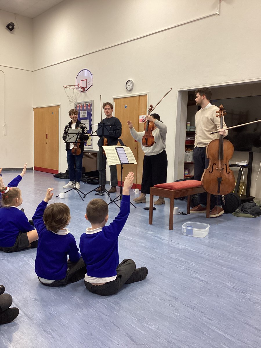 crowanschool's tweet photo. This week we were lucky enough to have a visit from @ElmoreQuartet , who performed a range of music for the children and taught them about their instruments. The children were mesmerised by their performance! We felt very privileged to hear them. https://t.co/8SnBsFGh3P