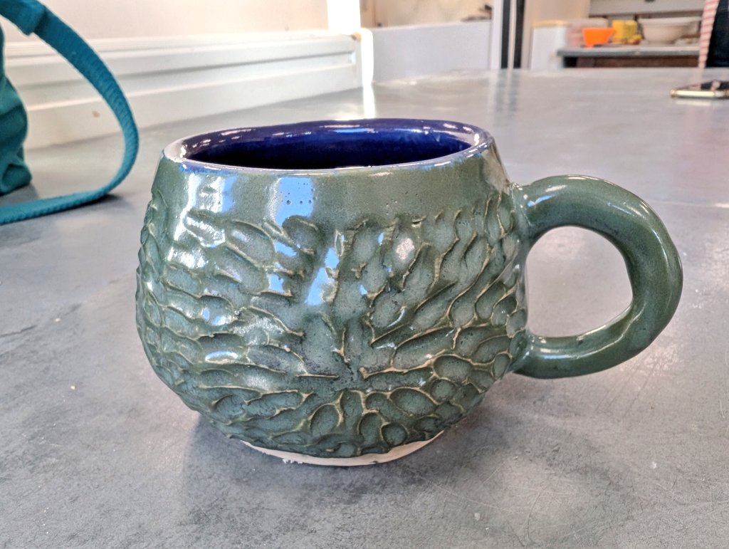 Reellie70's tweet image. This mug came back &amp;amp; I used my #Amaco brush on glazes with tourmaline on the outside &amp;amp; inside was a mix celadons cobalt &amp;amp; Snapdragon at 50/50 to make a purple. #pottery #ceramics
