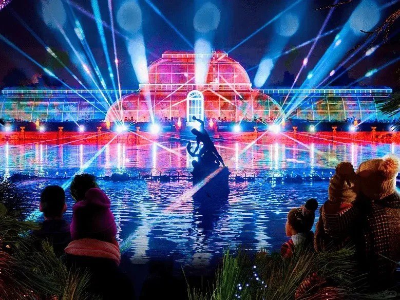 orientalli's tweet image. A vibrant carnival of colors and lights illuminates the lively street, filled with festive energy."