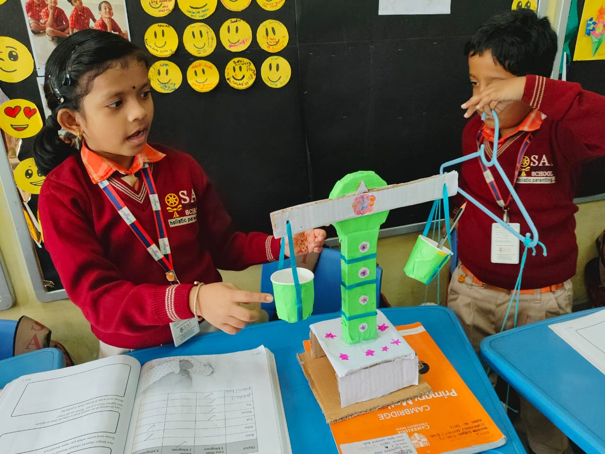 SAI_Edu_In's tweet image. On November 26, 2024, Class I SAIoneers delved into the concept of weight measurement through a fun and engaging activity. Using crafted beam balances, they compared objects, observed scale movements, and solved related problems. 
#CambridgeLearning #CraftInMaths #FunActivity