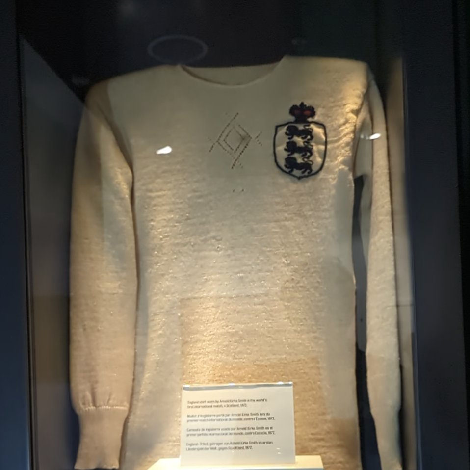 A wide shot of a white wool knitted shirt