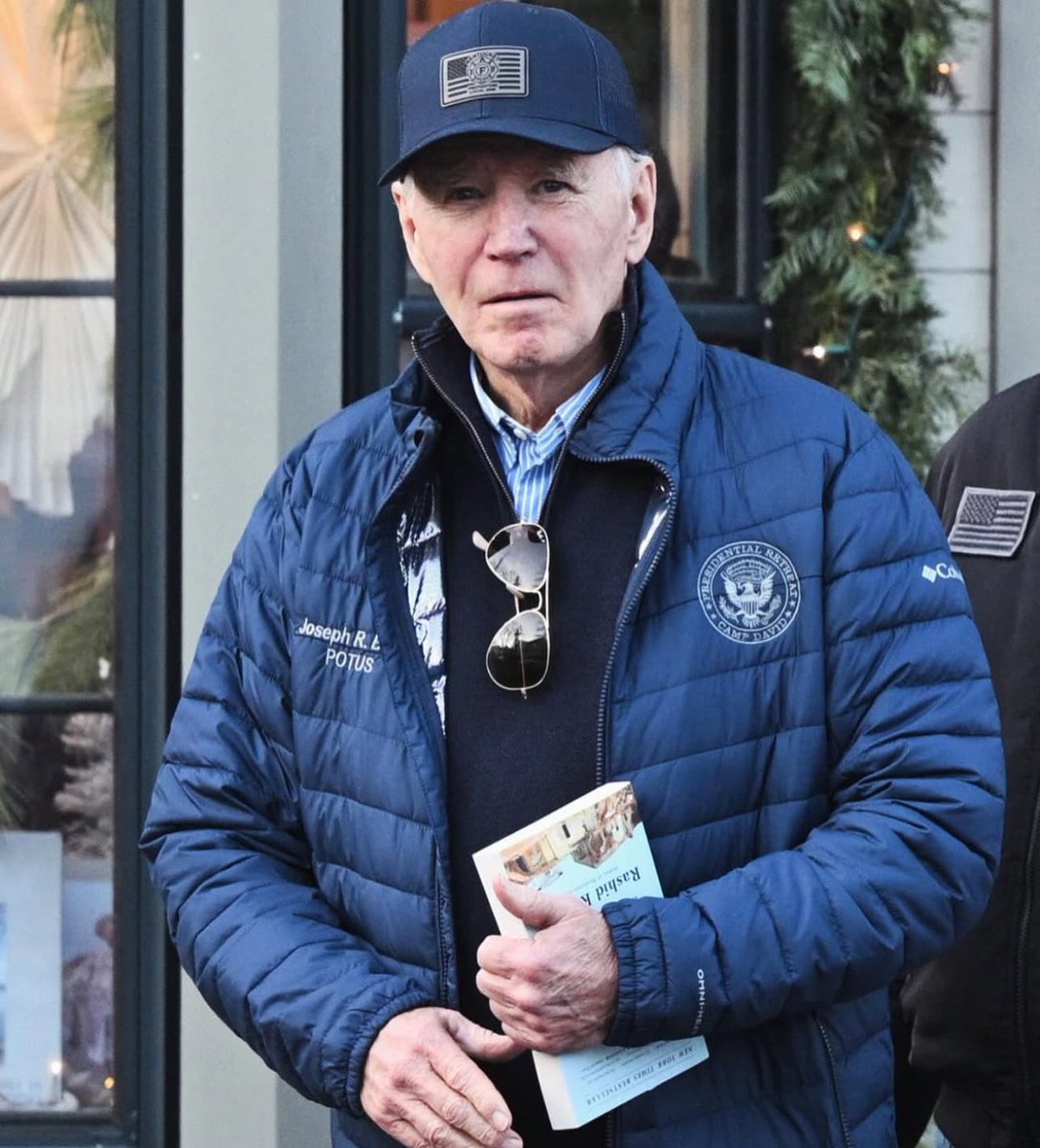 FalastineL's tweet photo. Joe Biden was seen carrying a copy of "The Hundred's Year War on Palestine" by Palestinian-American professor Rashid Khalidi, after having enabled the Israeli genocide in Gaza for more than 13 months. https://t.co/KgLKnqqs7y