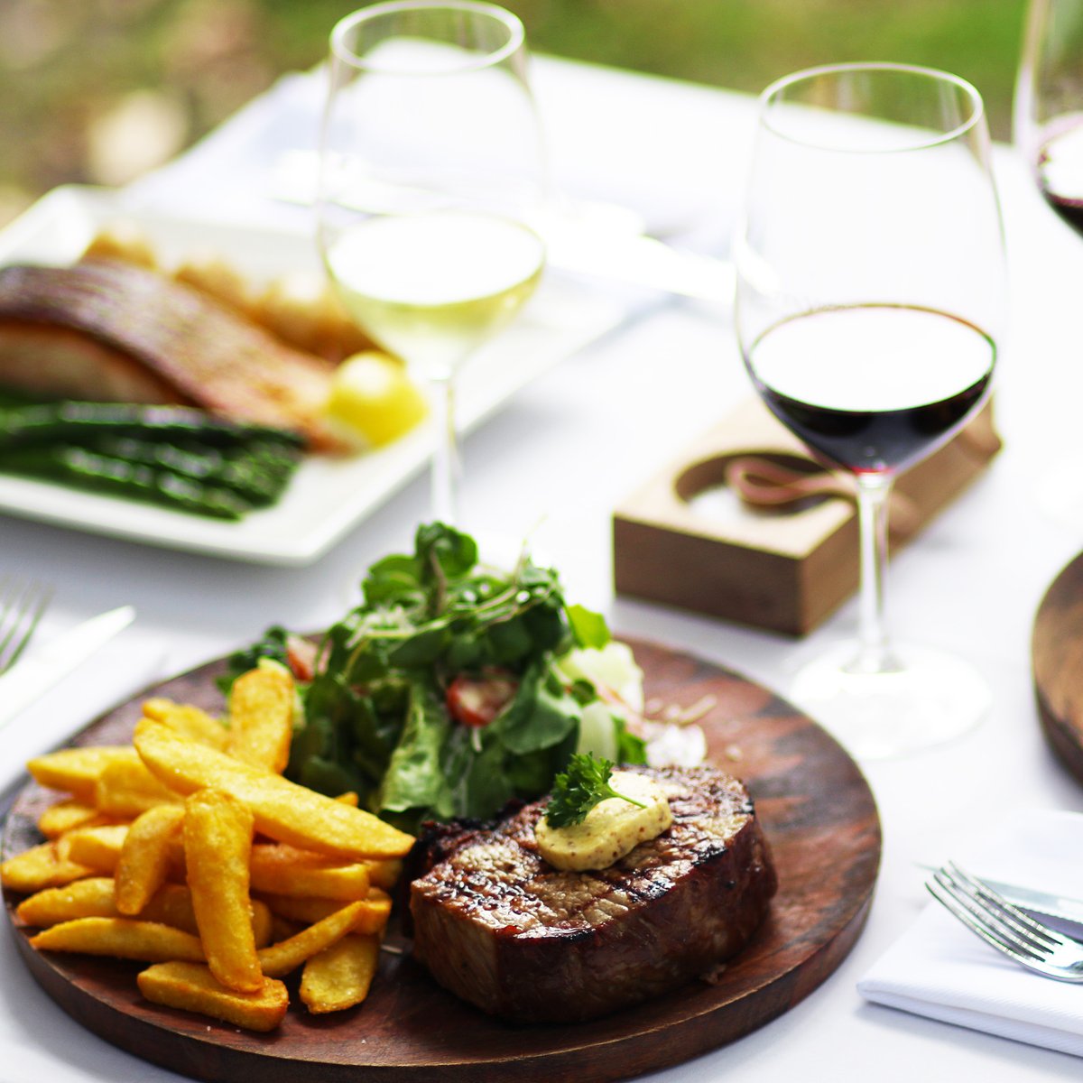 Wine Tasting and the Winemaker's Lunch at the Rust en Vrede Tasting Room. Enjoy a relaxing afternoon with good wine and food, under the oaks, with views of the Stellenbosch mountains. No reservations. First come, first served.