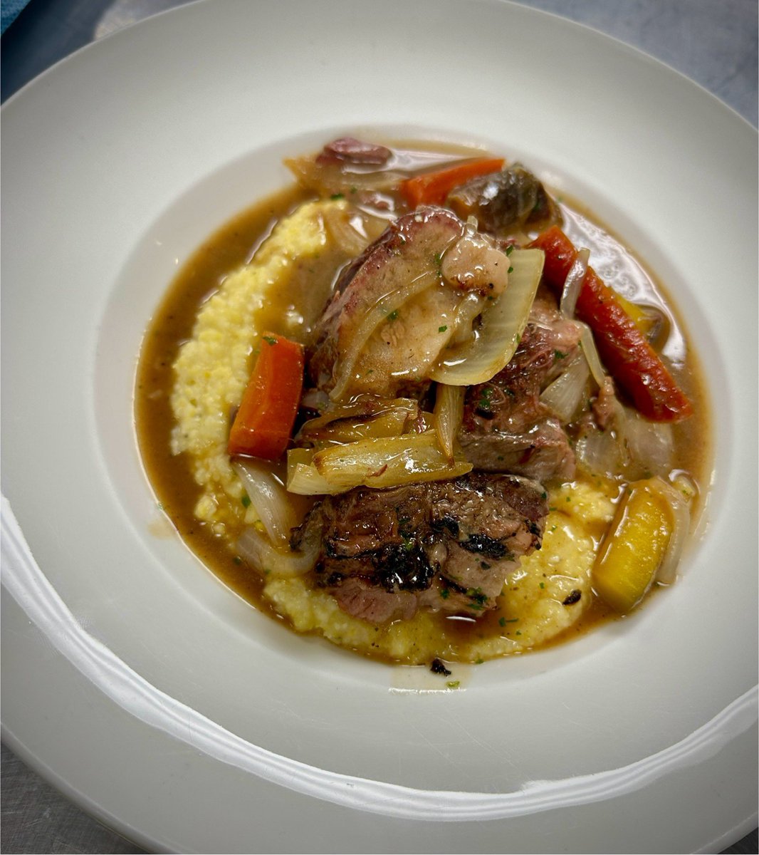 We brought out the HEAT for this snowy weekend! Braised Beef Short Rib “Pot Roast”, features tender prime beef shorty, braised super slow in a caramelized onion beef broth finished with a little sherry, roasted Oles Carrots and onions, over <a href="/marshhenmill/">Marsh Hen Mill</a> sweet corn grits!  WOWZA!