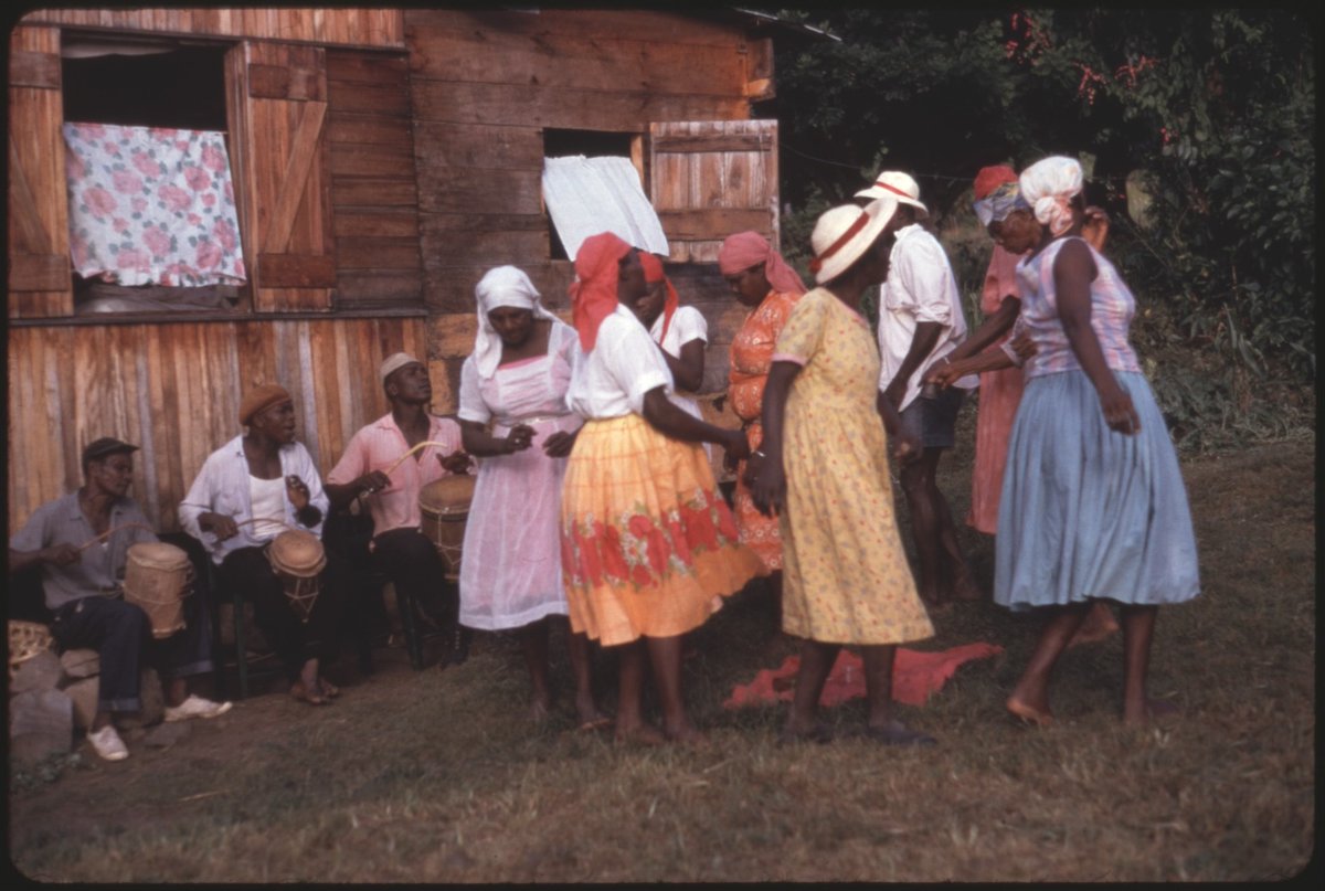 MythoCaribbean's tweet photo. Shangó Ceremony. Grenada, 1962. 

Musicians playing Dondo Drum, and a Shekere. https://t.co/6zUEZbUvSa