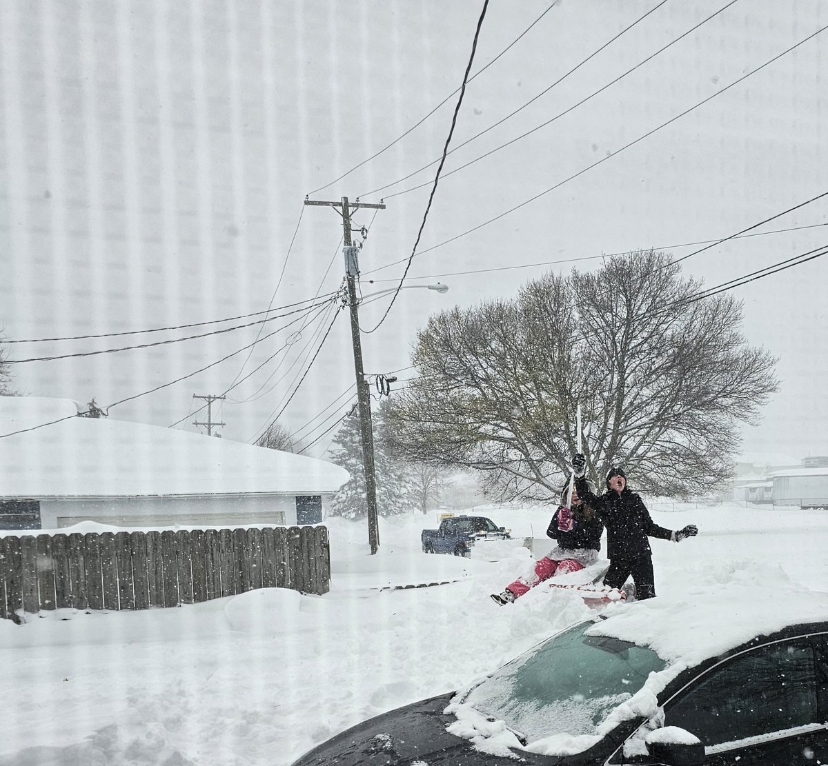 North East, Pa. with 43 inches of snow in 36 hours, beating out all the other small towns in Erie County getting pummelled by this epic lake effect snowstorm. My daughters celebrate with icicle swords atop a massive snow drift. They've been waiting/wishing for snow for weeks.