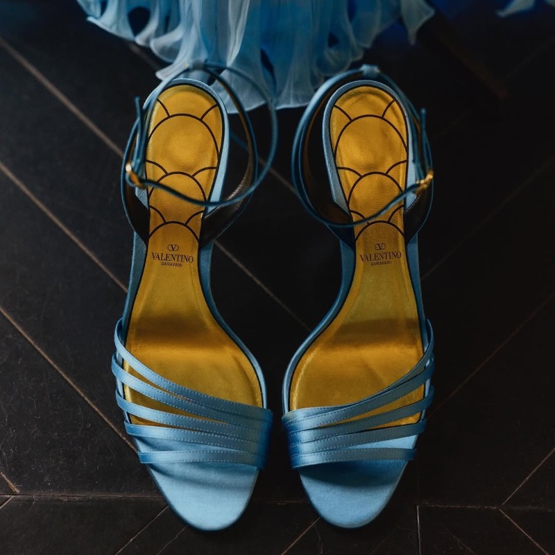 MaisonValentino's tweet photo. For 'Le Bal des Débutantes' in Paris, Apple Martin wore a custom #ValentinoHauteCouture gown by Creative Director #AlessandroMichele. Crafted from ciel bleu silk plissé chiffon, the dress features intricate vertical pleats and a black silk bow at the waist.