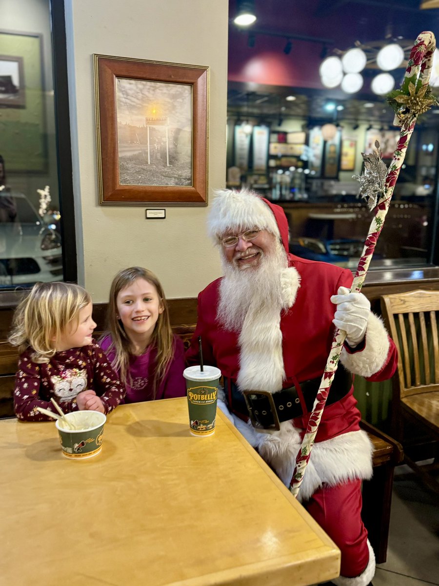 While at the Issaquah shopping center, the girls asked to see Santa, but I said we’d wait until another time when we’re dressed up. Later, as we finished dinner, we heard a booming "Ho-ho-ho!" and Santa walked into Potbelly Sandwich Shop and came right up to our girls. A magical