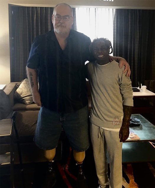 Lil Wayne with the police officer, "Uncle Bob," who saved his life when he was 12 years old.