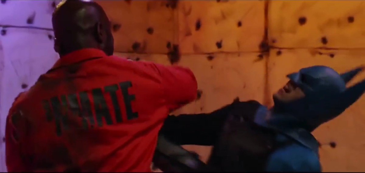 Man90B's tweet image. TwoFace proves too powerful for Batman. Smashing his body and cowl into the wall, landing several hard hits into the hero's abs and below the belt. 

#batman #batmanbeaten #herointrouble