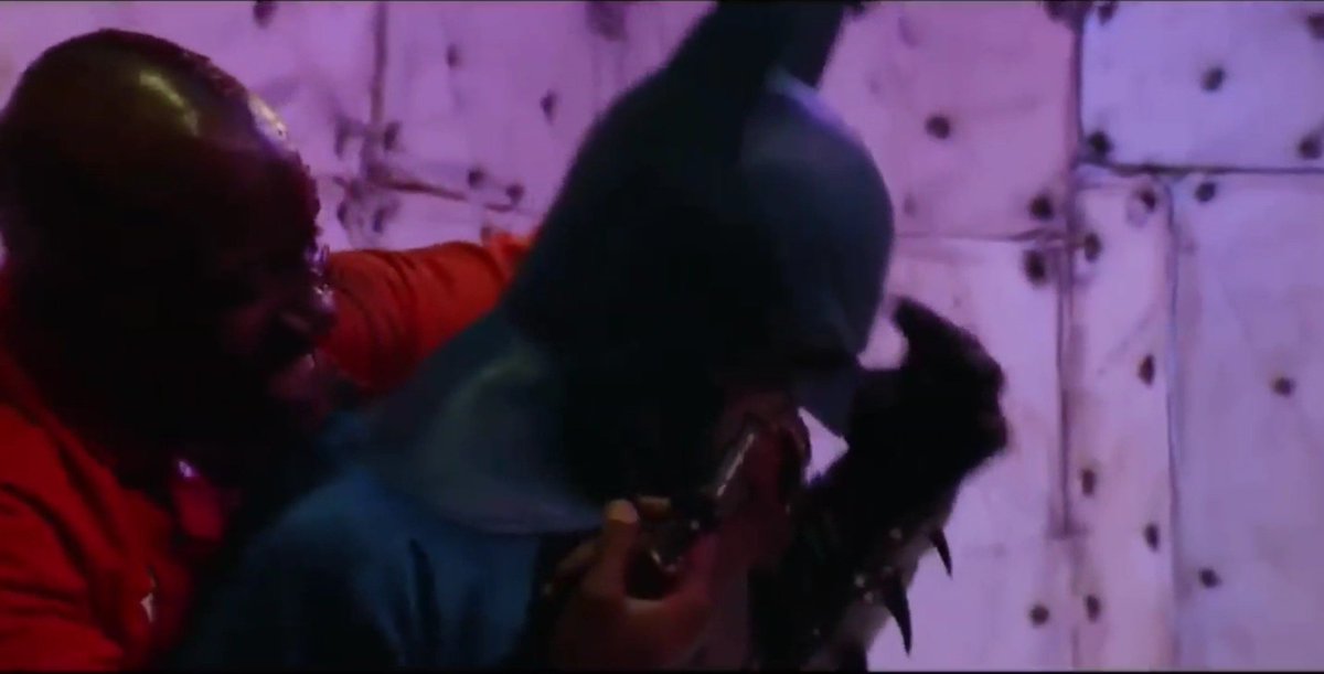 Man90B's tweet image. TwoFace proves too powerful for Batman. Smashing his body and cowl into the wall, landing several hard hits into the hero's abs and below the belt. 

#batman #batmanbeaten #herointrouble