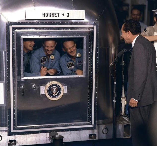 historyinmemes's tweet photo. Nixon greets Apollo 11 astronauts after they returned to Earth, as they quarantine for "extraterrestrial pathogens." (1969) https://t.co/8GC2ctKS9h