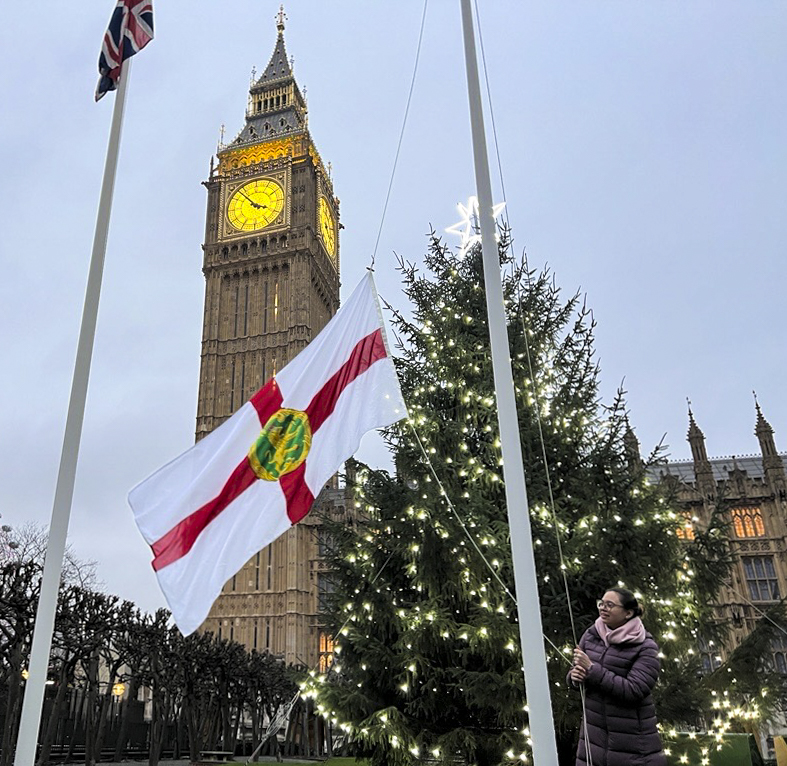 CommonsSpeaker's tweet photo. The flag of the Alderney, part of the Crown Dependency of the Bailiwick of Guernsey, has been raised in New Palace Yard to mark their Homecoming Day today. The day recognises the islanders return home following the German occupation in WWII. https://t.co/zRhu08ECIo