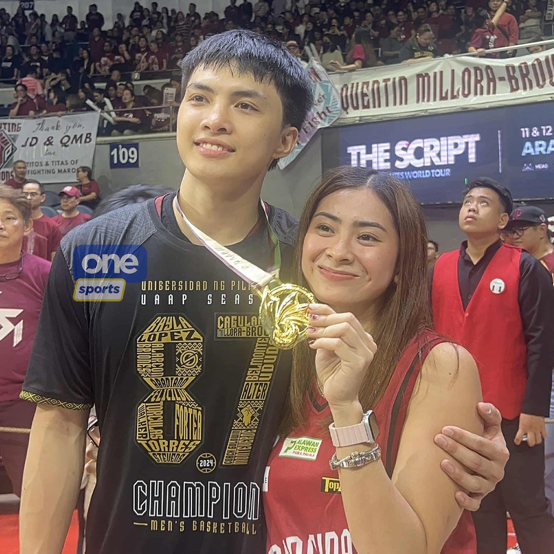 OneSportsPHL's tweet photo. CHAMPION PATI SA LOVE LIFE😍

Harold Alarcon shares a sweet moment with his partner and volleybelle Roma Mae Doromal after UP reclaimed their glory against DLSU at the #UAAPSeason87 men's basketball! | via Xander Cipriano, Kiko Demigillo

#StrongerBetterTogether #OneSports https://t.co/bc4mjeRxB8