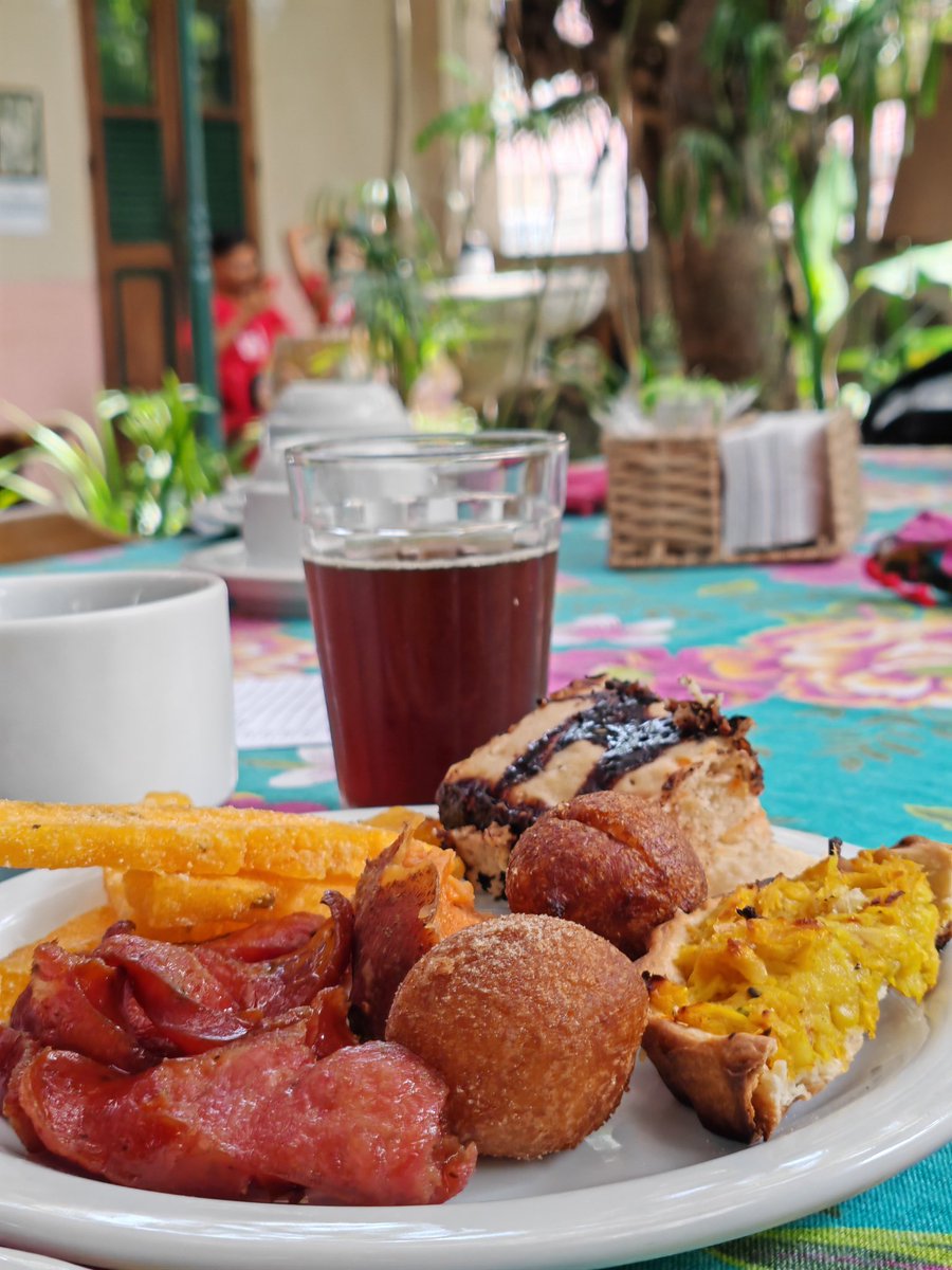 JaiGupte's tweet photo. A very special morning at Raizes do Brazil (https://t.co/pFpQpQYLQ8) a café run by the Small Farmers Movement (MPA) as an organized space to integrate peasant agroecology and urban society. every Saturday they serve a delicious Café Camponês and brunch, made with organic and locally grown produce, to further an ethos of food sovereignty - cooked and served with love. Thank you to @jemfiori for the wonderful introduction to the intricately complex neighbourhood of Santa Teresa in Rio de Janeiro - a neighborhood of striking contrasts, where colonial mansions and cobblestone streets sit alongside favelas, and bohemian artists mingle with long-time residents and tourists. Its vibrant culture and iconic landmarks mask deep social inequalities and ongoing tensions over gentrification and urban development. Both a haven of creativity and a battleground for urban justice, Santa Teresa perhaps embodies the complexity of #Rio itself.