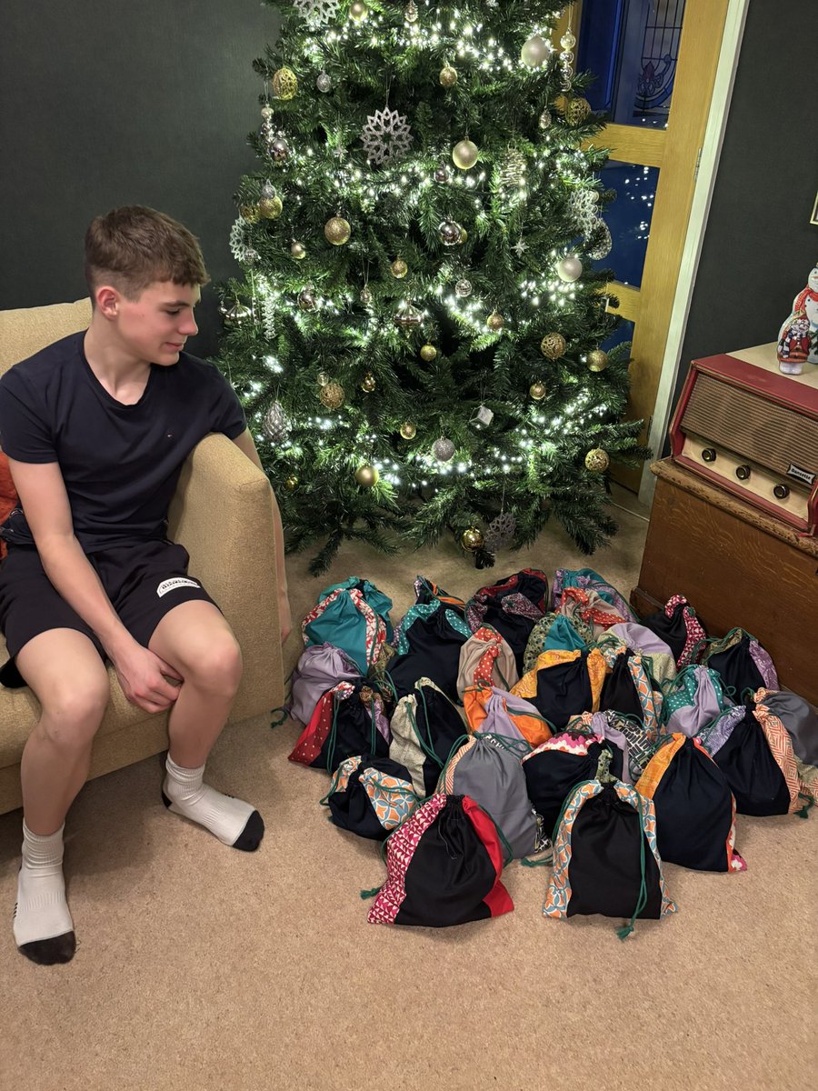 j_chestnutt's tweet photo. Jasper’s volunteering work for his DofE award - 30 Christmas gift bags sewn and filled with things for our local rough sleepers, to be distributed at the Christmas dinner we’ll serve them this week 
@DofE @HillHouseSchool https://t.co/45qCF1hN0k