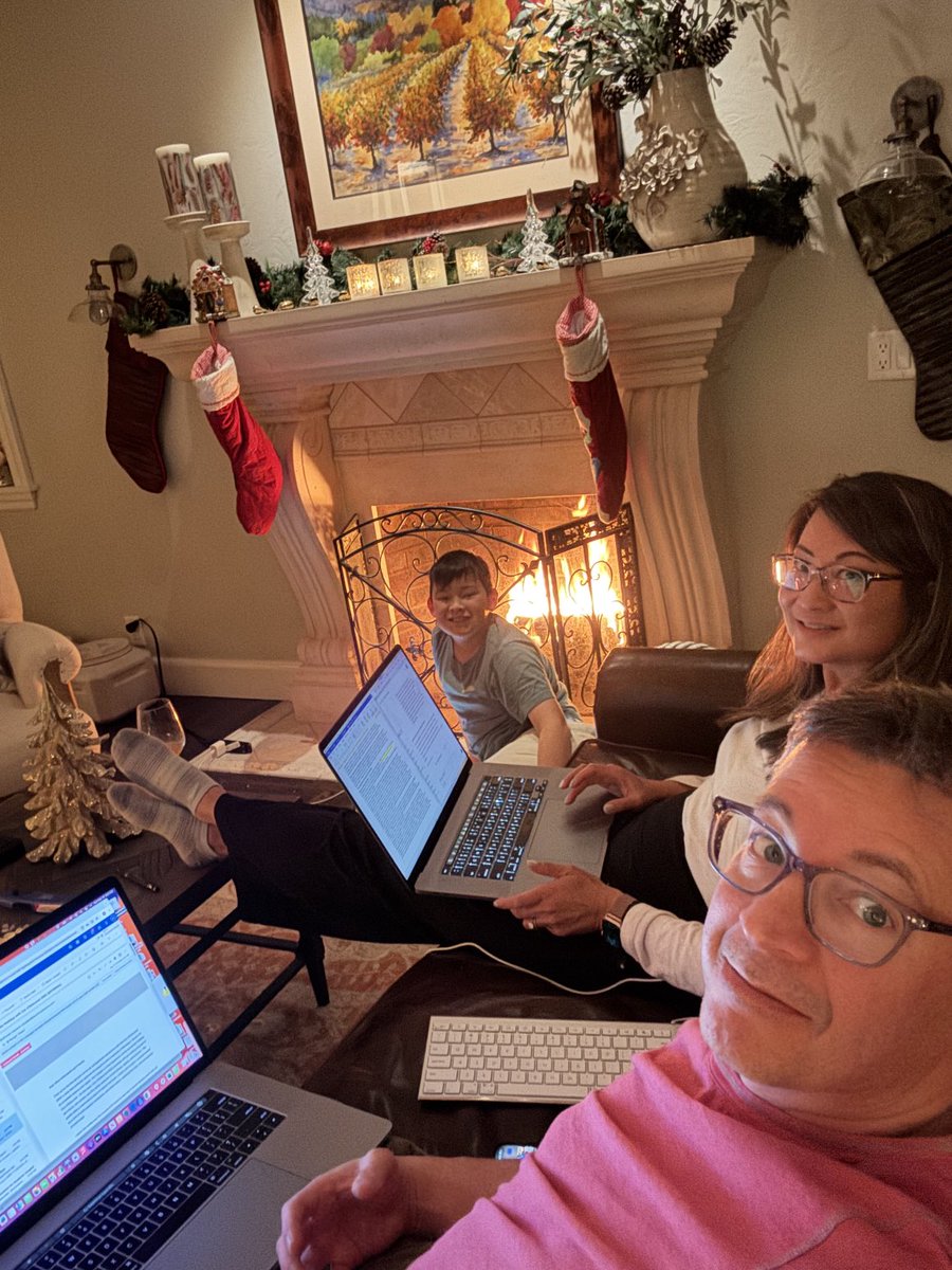 Christmas mood in this dual academic surgeon family=grants, emails, and YouTube by the fire. Not pictured: cocktails and hot chocolate make you more productive. #surgparenting