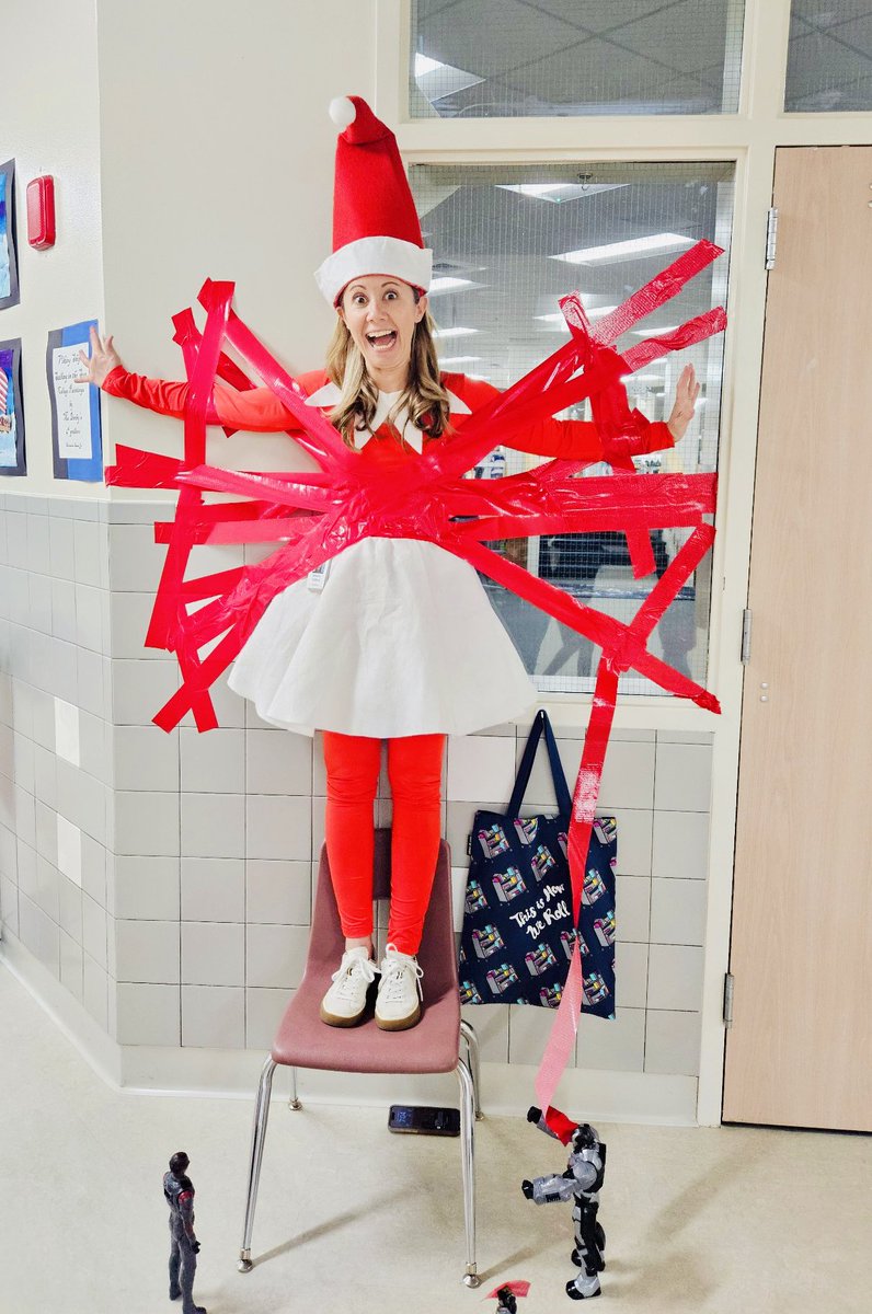 SRE Stallions (@srestallions) on Twitter photo These superhero toys were up to no good this morning! They taped these principal elves to the wall! Luckily we have a lot of amazing students who volunteered to help run the school today and free them from the tape web! <a href="/SRE_Principal/">Britteny Clifford</a> These superhero toys were up to no good this morning! They taped these principal elves to the wall! Luckily we have a lot of amazing students who volunteered to help run the school today and free them from the tape web! <a href="/SRE_Principal/">Britteny Clifford</a>