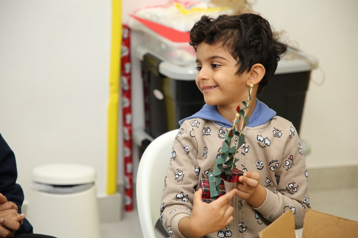 TheHDubai's tweet photo. Spreading joy and inclusivity this festive season! 🎄 The H Dubai team hosted a heartwarming Craft Workshop with the amazing kids at @georgetownuae, creating beautiful festive tree centerpieces. 

#ithappensath #AutismAwareness #FestiveForAll https://t.co/DLn7N3Zra0