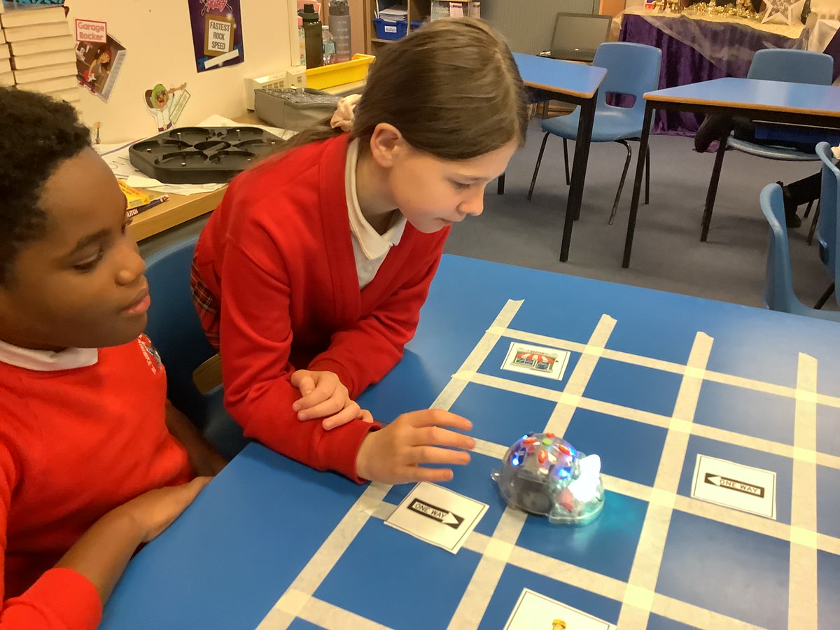 StJosephsM5's tweet photo. On Friday, Year 6 completed their robotics challenge with a computing session. They programmed the BeeBots to travel from the shop to the house avoiding the obstacles. They all really enjoyed the activity. @EngEdChallenge  @UoMSEERIH. https://t.co/MLpHSLI3wf