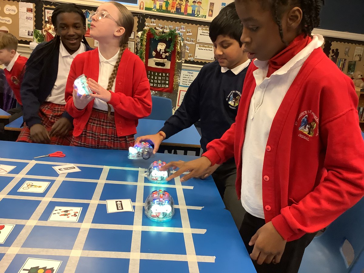 StJosephsM5's tweet photo. On Friday, Year 6 completed their robotics challenge with a computing session. They programmed the BeeBots to travel from the shop to the house avoiding the obstacles. They all really enjoyed the activity. @EngEdChallenge  @UoMSEERIH. https://t.co/MLpHSLI3wf